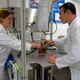 Beth Lomax of the University of Glasgow and ESA research fellow Alexandre Meurisse preparing to make oxygen and metal out of simulated moon dust at ESA’s Materials and Electrical Components Laboratory.